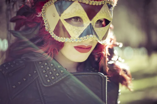 Woman in colorful venetian mask — Stockfoto