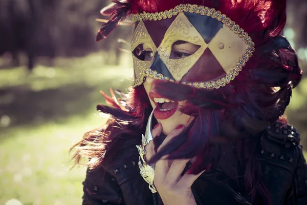 Woman in colorful venetian mask