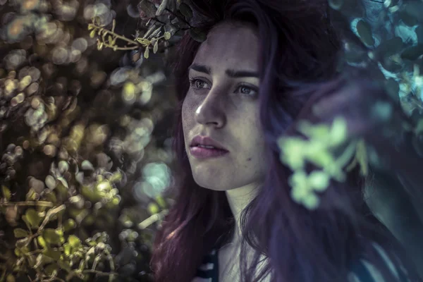 Melancholy, young woman in forest — Stock Photo, Image