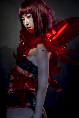 Beautiful, asian woman in abstract clothing