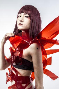 Beautiful, asian woman in abstract clothing