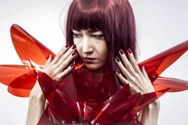 Beautiful, asian woman in abstract clothing