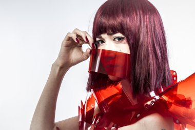 Beautiful, asian woman in abstract clothing