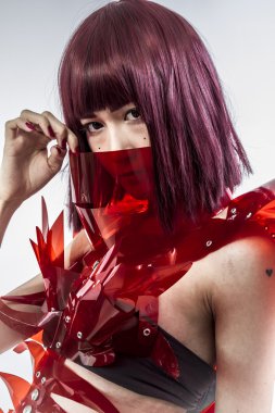 Beautiful, asian woman in abstract clothing