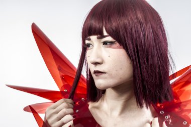 Beautiful, asian woman in abstract clothing