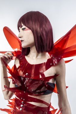 Beautiful, asian woman in abstract clothing