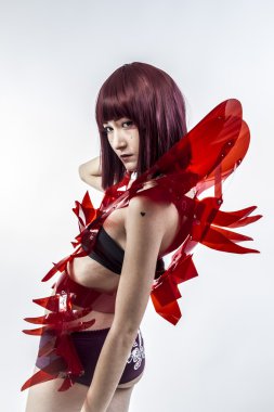 Beautiful, asian woman in abstract clothing