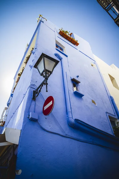 Corner of building with lantern and  road sign — Stock Photo, Image