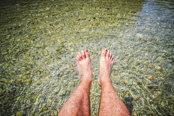 Man keeping his legs water — Stock Photo, Image