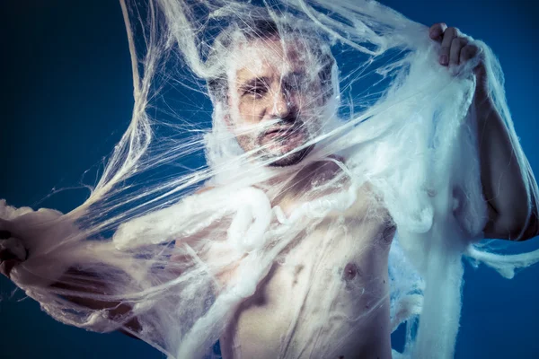 Naked man trapped in spider web — Zdjęcie stockowe