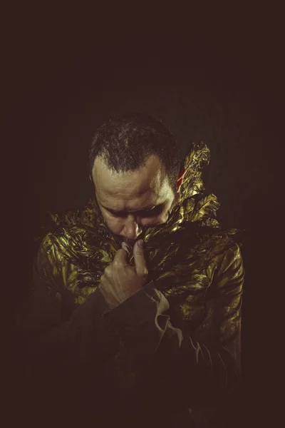 Man with golden jacket — Stockfoto