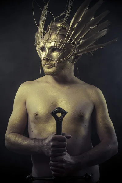 Warrior with helmet and sword — Stock fotografie