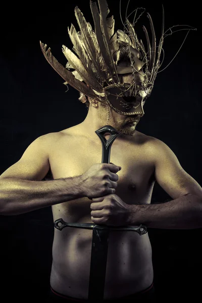Warrior with helmet and sword — Stok fotoğraf
