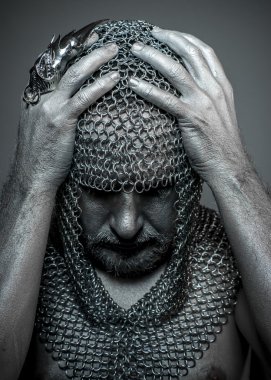 medieval executioner in mesh iron rings on the head clipart