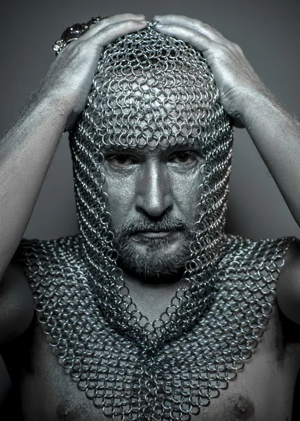 Medieval executioner in mesh iron rings on the head — Stock Photo, Image