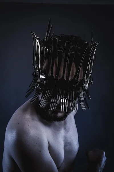 Man with a crown of forks and knives — Stok fotoğraf