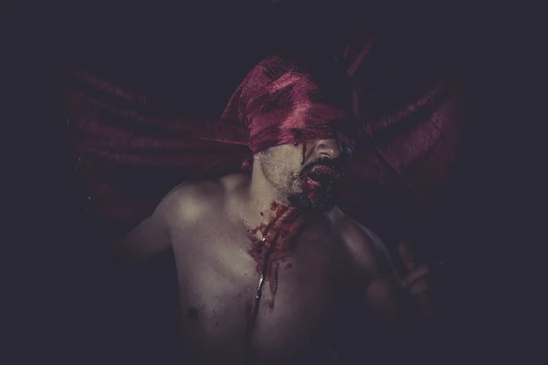 Man on red cloth over his eyes — Stock Photo, Image