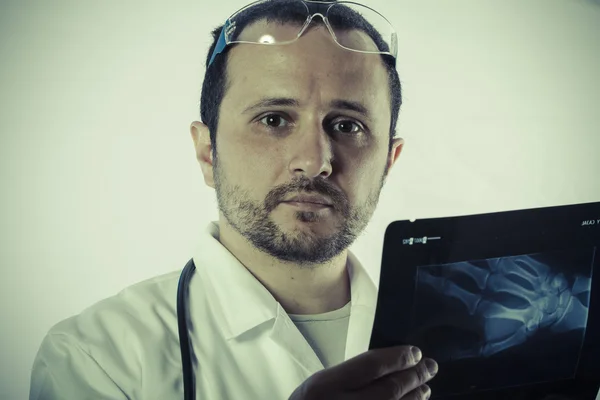 Radiologist looking at an x-ray — Stock Photo, Image