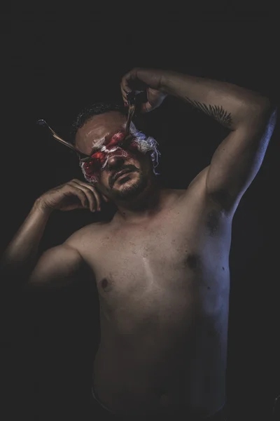 Naked man with blindfold and forks — Stock Photo, Image