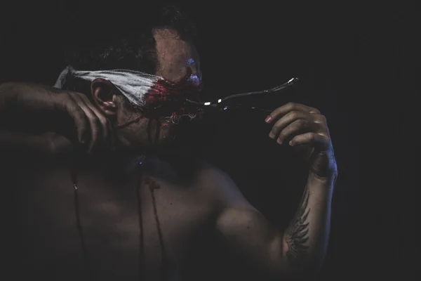Naked man with blindfold soaked in blood — Stock Photo, Image