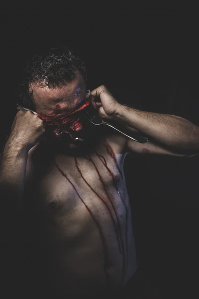 Naked man with blindfold soaked in blood — Stock Photo, Image