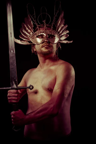 Warrior with golden mask — Stock Photo, Image