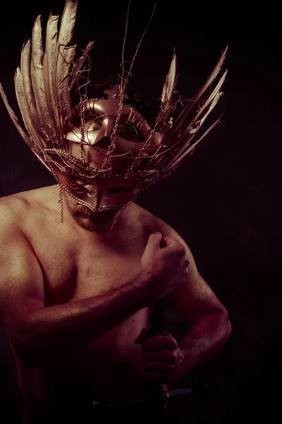 Warrior with golden mask — Stock Photo, Image