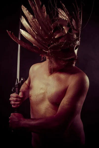 Warrior with golden mask — Stock Photo, Image