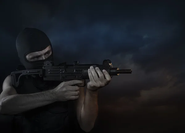 Balaclava and terrorist with machine gun on Cloud Background — Stock Photo, Image