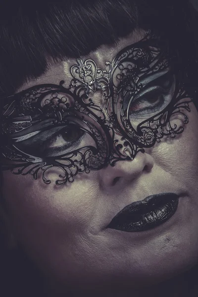 Woman in black mask with thread — Stock Photo, Image