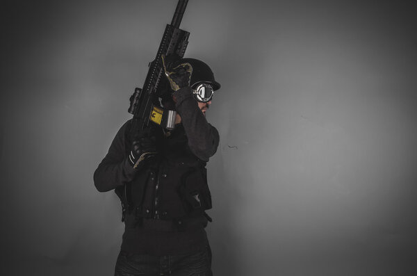 airsoft player holding gun