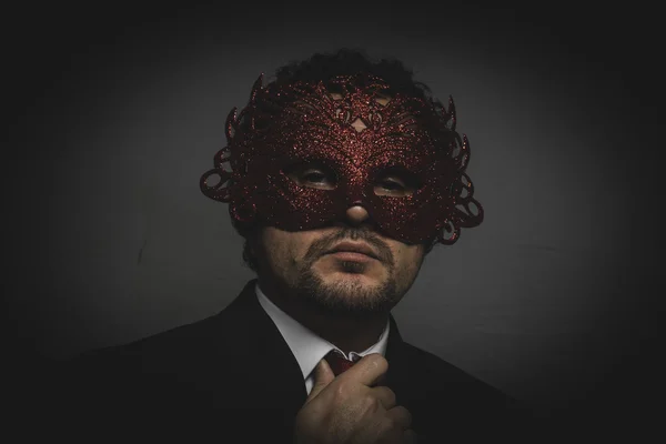 Man wearing mysterious Venetian mask — Stock Photo, Image