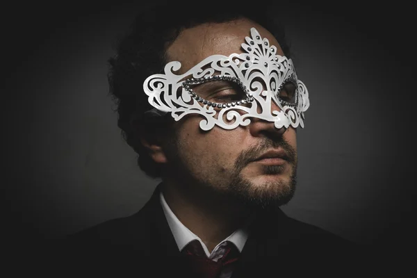 Man wearing mysterious Venetian mask — Stock Photo, Image