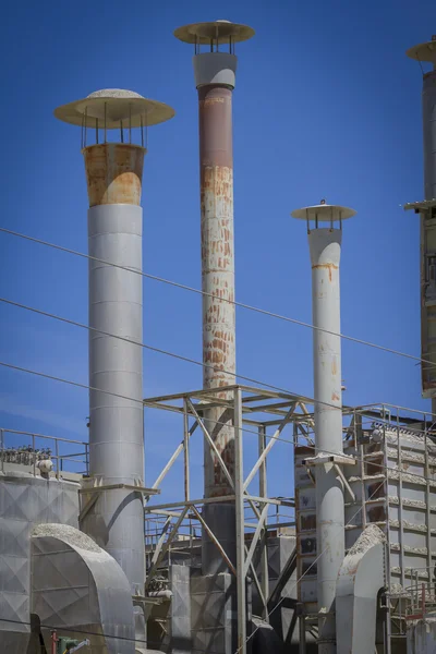 Tube and industrial chimneys in area construction companies — Stock Photo, Image
