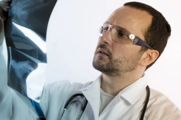 Radiologist looking at an x-ray — Stock Photo, Image