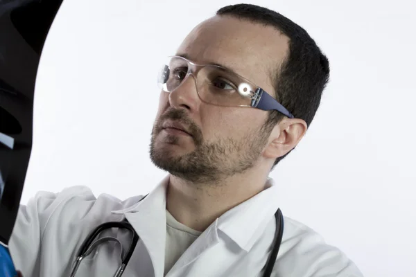 Radiologist looking at an x-ray — Stock Photo, Image