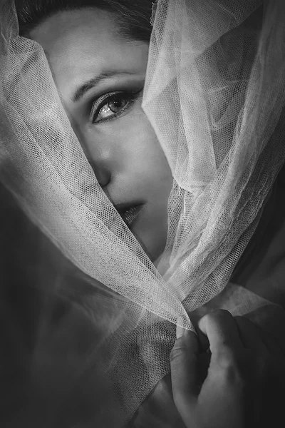 Pretty Sensual blonde with fine white silk cloth lying in bed — Stock Photo, Image