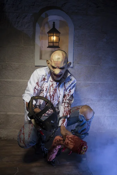 Man in mask with blood on clothes — Stock Photo, Image