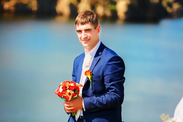 Happy young groom with a beard on their wedding day — Stock Photo, Image