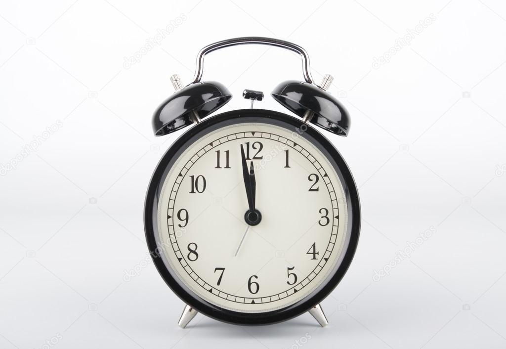 Two minutes to twelve o'clock. Alarm clock.