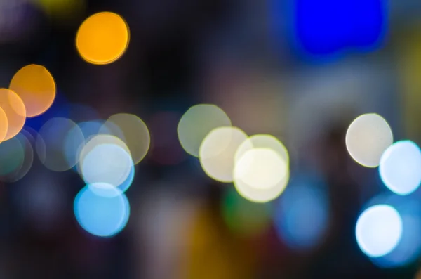 Defocused urban abstract texture, bokeh lights of city lights in the background with blurring lights — Stock Photo, Image