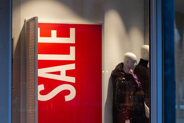 sale display in city mall at winter evening in red color