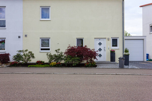 modern house facade with white and grey colors in germany spring countryside