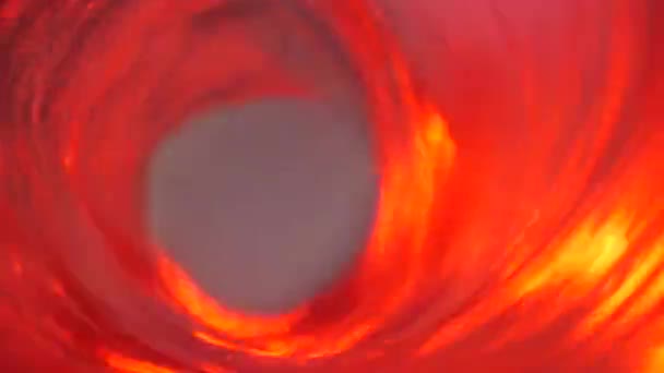 Symbol of hell, inferno and infinity. Red liquid hypnotic looped aqua swirl turning. Meditative luminous whirlpool. Mesmerising spiral tunnel of crystal fluid. Fiery surreal rhythmic water gradient — Stock Video
