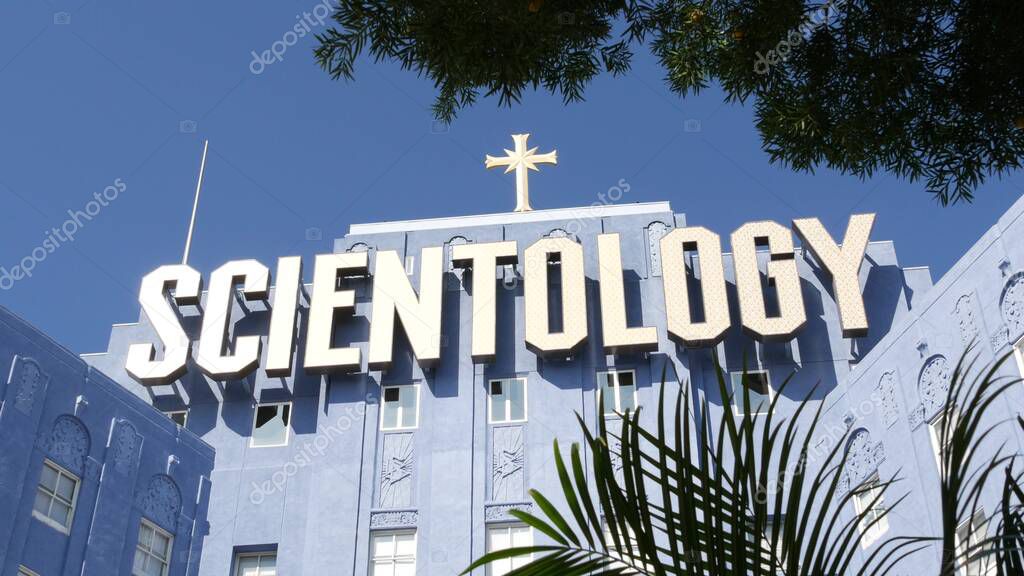 Los Angeles, California USA - 24 Feb 2020: Church of Scientology exterior, facade of blue building near American Saint Hill Organization in Hollywood. Logo and cross. International religious movement.