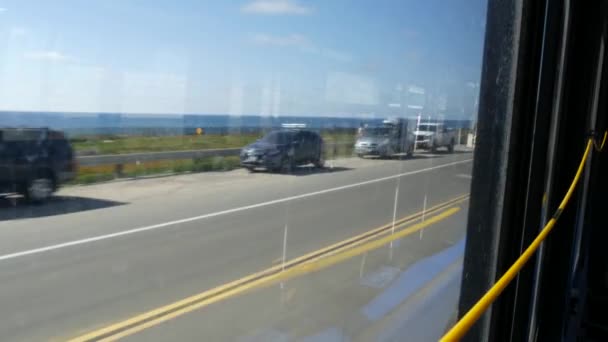 Bus window, pacific coast highway, freeway 101, California USA. Road trip along summer ocean or sea. — Stock Video