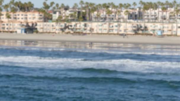 Pacific ocean coast from pier. Sea waves. Beachfront vacations. California USA. Palm tree and houses — Stock Video