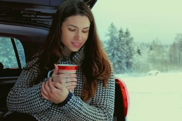 Young girl with cup of hot drink — Stock Photo, Image