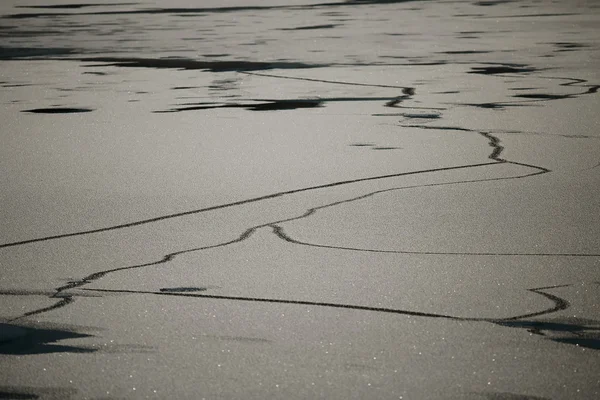 Cracked frozen lake — Stock Photo, Image