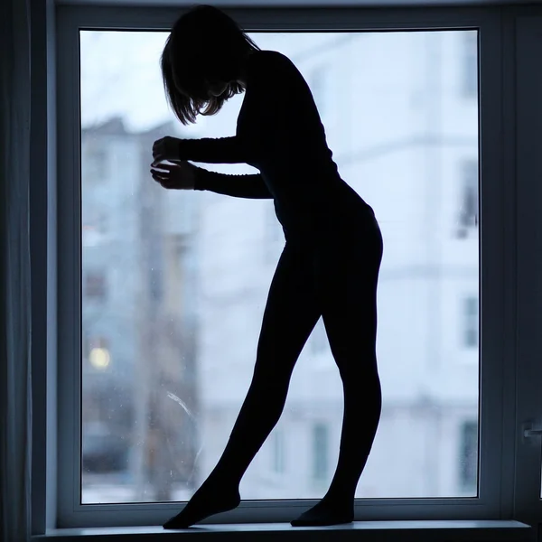 Silhouette of girl doing fitness — Stock Photo, Image
